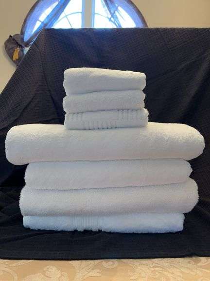 Grouping of 4 NEW white bath towels and 3 NEW hand towels image