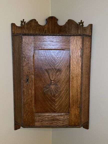 Vintage primitive oak hanging corner cabinet….does have key but lock needs reattached inside…..approx. 27” tall image