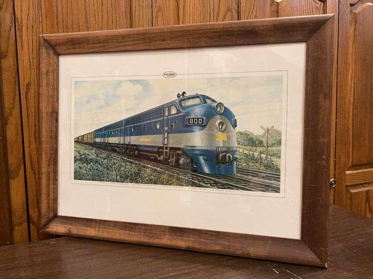 Framed print depicting F7 diesel locomotive, specifically unit number 800. This type of locomotive was built by the Electro-Motive Division of General Motors…..27-1/2 x 20-1/2…..frame has blemishes image