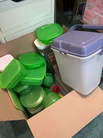 Box full of plastic storage containers, canisters and more image