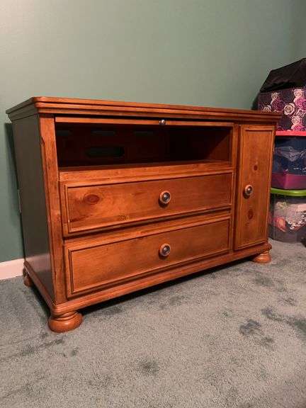Nice looking wooden computer desk unit in a light brown finish with two drawers, open area, a sliding desk, and a side cabinet…..45-1/4 x 20 x 29-1/2 tall image