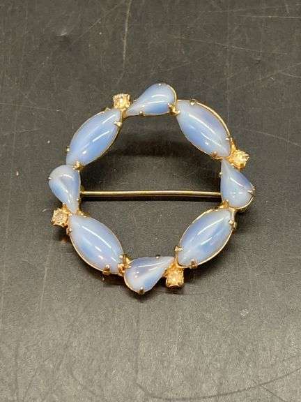 Very nice baby blue cat eye stone wreath shaped brooch with rhinestone accents image
