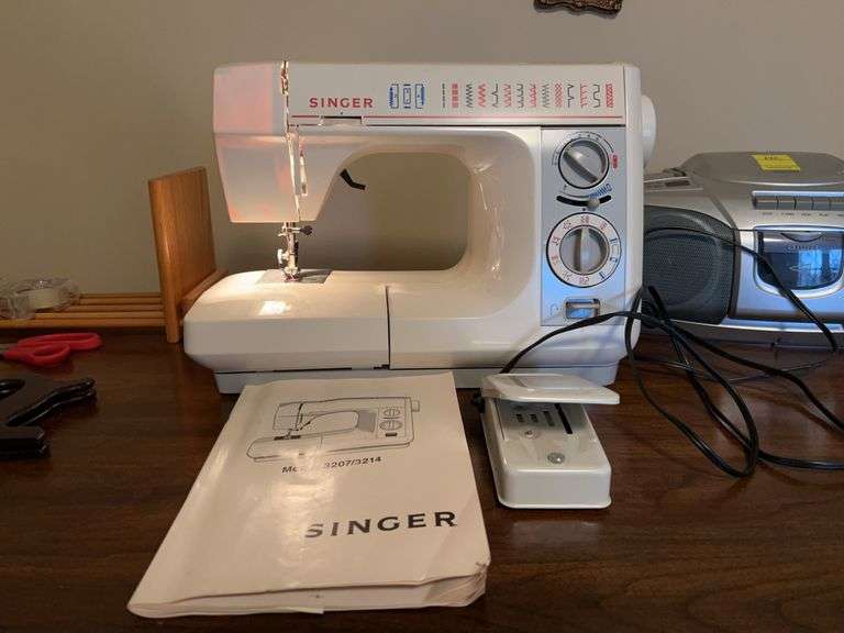 Singer model 3214 portable sewing machine….does power up and run when foot pedal is pushed image