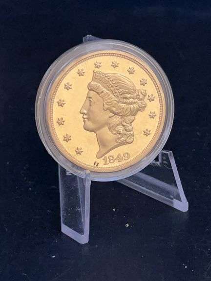 Replica or gilt version of an 1849 Liberty Head $20 gold coin, also known as a "Double Eagle"…..marked Copy on reverse image