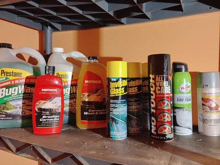 Assortment, 1 1/2 gal. Prestone Bug Wash windshield washer fluid, 1 full 16 oz. Mothers Brazilian Carnauba cleaner wax, 1 full 64 oz. Mothers Carnauba wash & wax, 2 1/2 19 oz. cans Stoner Invisible Glass window, windshield, mirror cleaner, 1 full 20 oz can No Touch All Wheel Care 3 in 1, 1 full 18 oz. can Turtle Wax wet n black Tire Foam, 1 full 11oz. can Dupli-Color Filler Primer High Build Formula. Full 12 oz. bottle Meguiar's Ultimate Black Plastic Restorer, 1/4 16 oz. spray bottle MOTHERS Showtime Instant Detailer, full 12 oz. bottle GOO  ADHESIVE REMOVER image