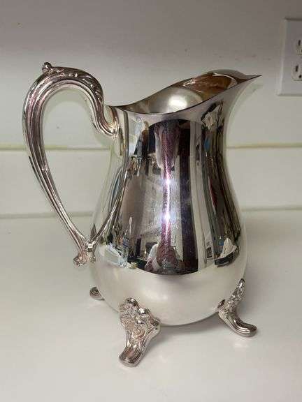 Great looking silver plate footed water pitcher with ice guard…..8-1/2” tall image