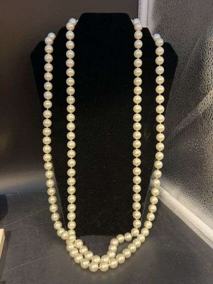 Very long strand of heavy pearl-like beaded necklace from Chico’s image
