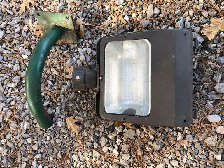 2 new Commercial General Electric  lights and 2 brackets for pole mounting and 1 add’l  piece. One in box and one out of box. Both are new. image