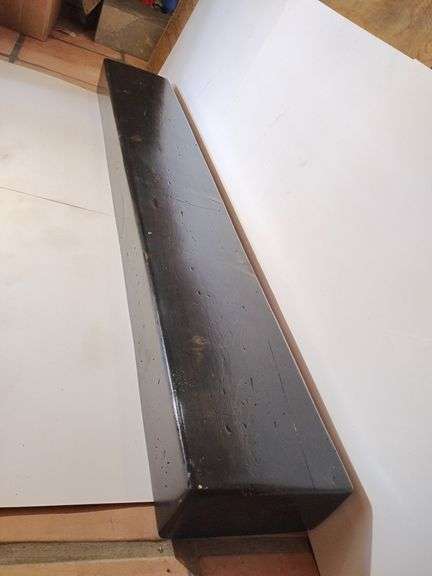 Mantle, very dark wood, almost black, shiny, very lightweight, slightly distressed, 5'L x 4 3/4"T x 9 1/4"D image