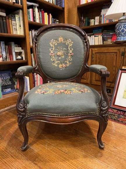 Victorian-style carved walnut armchair featuring blue/green floral needlepoint upholstery….. 25-1/2 x 20-1/2 x 39-1/2 tall image