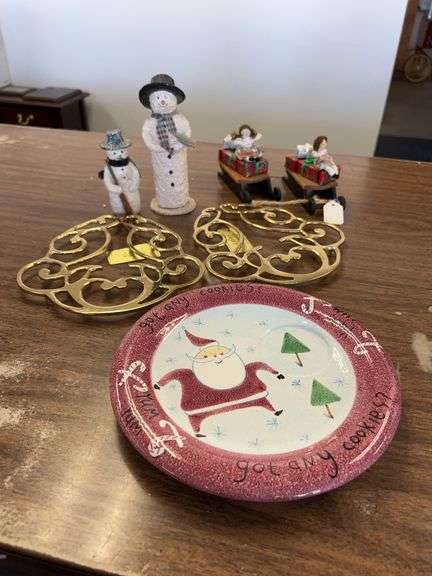Assortment of Christmas decor…..snowmen, (2) Byers Choice sleds with gifts, 2 brass trivets, Santa snack tray (no cup) and bronze-like base side table lamp with glass tulip shade (see pics) image