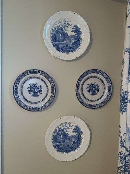 (4) blue and white decorative plates with plate hangers image