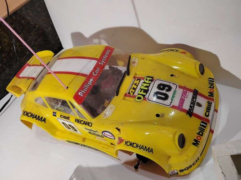 Tamiya 1/10 Scale 1996 Porsche 911 GT1, vintage 1/10 scale Nitro RC Kyosho GP10 or a Thunder Tiger Pada Challenger, Vintage Futaba Magnum Sport FPTZPD Proportional RC System Transmitter, tools, accessories. Untested. Plus, the original box to the FUTABA controller. Plus, a box of parts, stickers, many more items. image