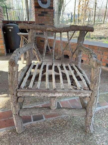Handcrafted rustic outdoor chair…..handcrafted from possibly small willow or oak trees(?)…..25-1/2 x 22-1/2 x 32 tall overall image