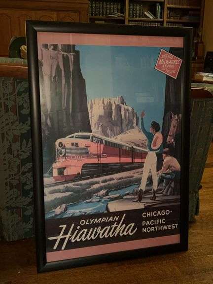 Framed reproduction of a vintage travel poster advertising the Chicago, Milwaukee, St. Paul and Pacific Railroad's "Olympian Hiawatha" train service…..26-1/2 x 38-3/4 image