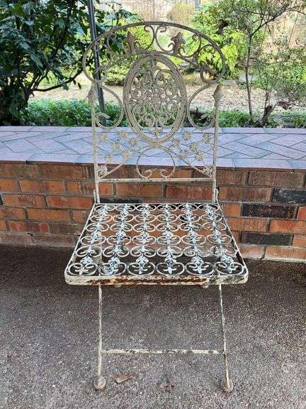 Vintage wrought iron folding chair…..15 x 14 x 36 tall overall…..does show rust but is a sturdy piece image