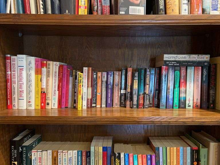 Shelf of both paperback and hardback novels image