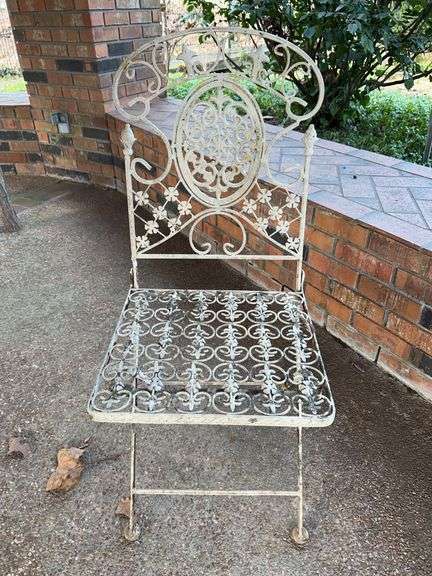 Vintage wrought iron folding chair…..15 x 14 x 36 tall overall…..does show rust but is a sturdy piece image