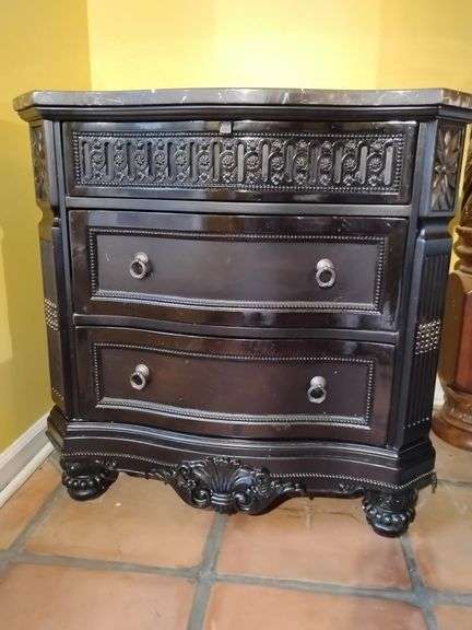 Ashley Britannia Rose Nightstand 3 drawer Black Rose Finish with marble top. 34 1/4" T x 34 1/2" W x 20" D. Good condition. Located on 2nd floor. This piece is heavy. BUYER IS RESPONSIBLE FOR REMOVAL. image