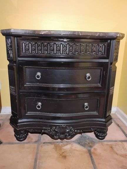 Ashley Britannia Rose Nightstand 3 drawer Black Rose Finish with marble top. 34 1/4" T x 34 1/2" W x 20"D. Few very small scratches right side. Located on 2nd floor. This piece is heavy. BUYER IS RESPONSIBLE FOR REMOVAL. image