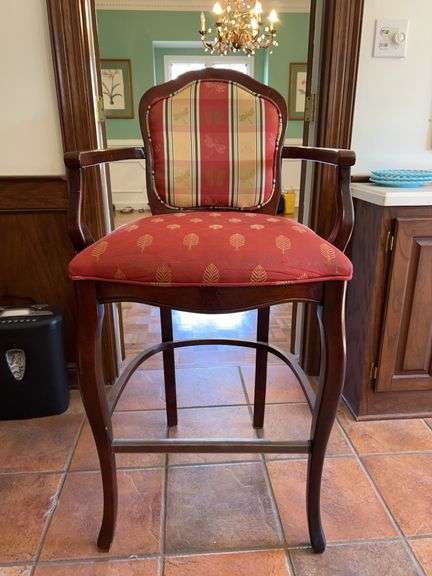 a Louis XV-style wooden bar stool with upholstered red and plaid/print fabric cushioned seat and back…..24 x 19 x 45-1/2 tall overall…..seat cushion needs cleaned image
