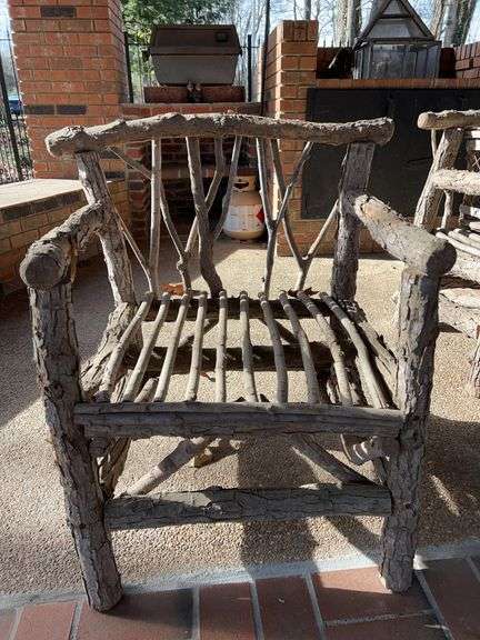 Handcrafted rustic outdoor chair…..handcrafted from possibly small willow or oak trees(?)…..26-1/2 x 23 x 32 tall overall image