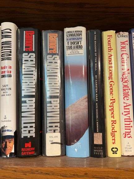 Shelf of novels by Lee Iacocca, Rush Limbaugh, James A. Michener…..only (1) Sam Walton is available and it’s the large print edition image