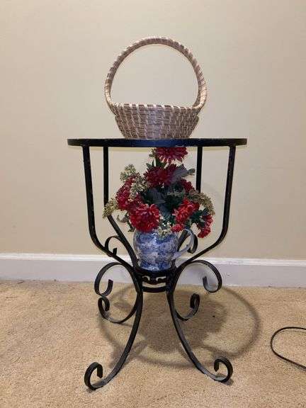 Smaller black metal base glass top table and contents….15-1/2”D x 21” tall image