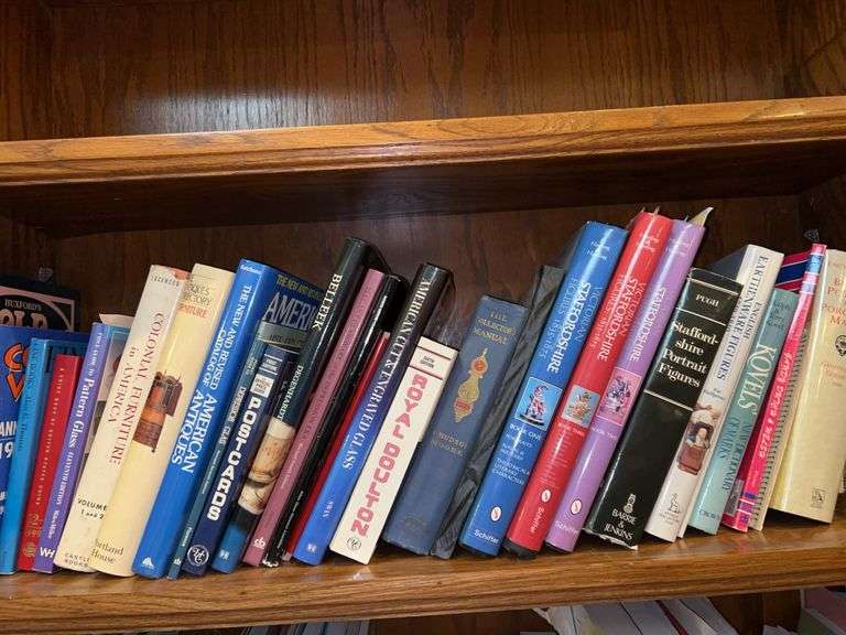 Shelf of books regarding antique furniture, collectibles, Staffordshire, British Pottery and more image