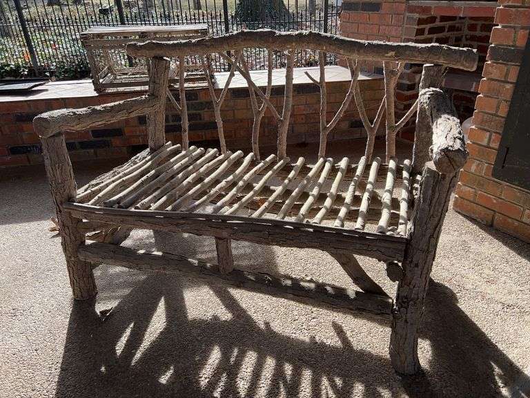 Handcrafted rustic outdoor loveseat…..handcrafted from possibly small willow or oak trees(?)…..46 x 24 x 34 tall overall image