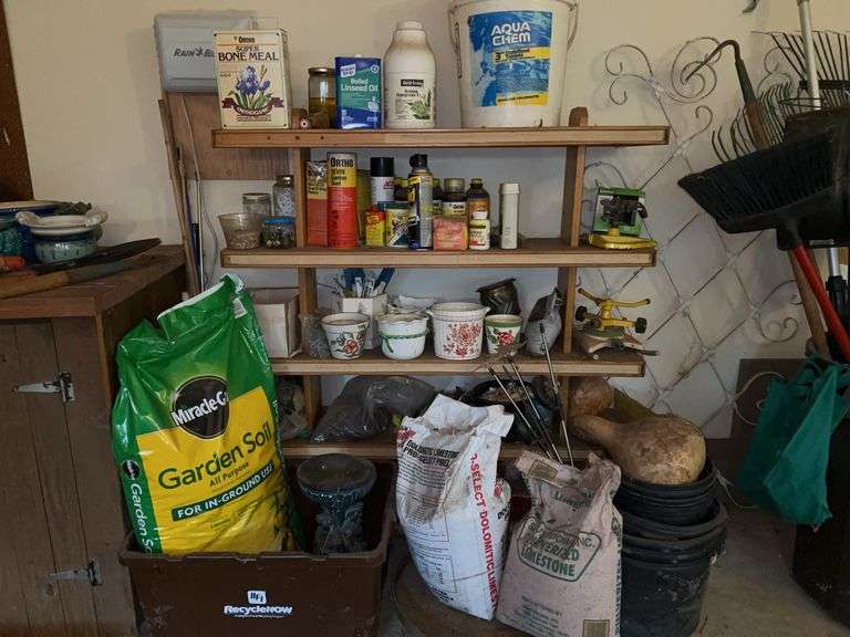 Shelving unit and contents of various lawn & garden needs….MUST TAKE ALL image