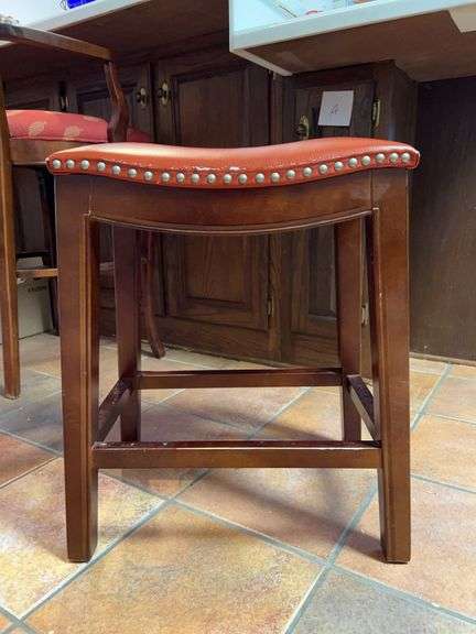Wood frame saddle seat stool with silver stud edging….edge shows wear from normal use…..18-1/2 x 12-1/2 x 24 tall image