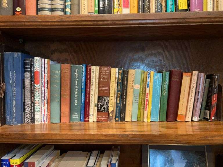 Shelf of both hardback and paperback books by various authors and various genres image