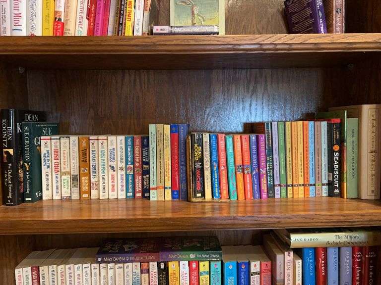 Shelf of books by various authors and various genres image