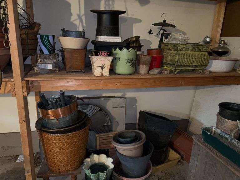 Grouping of flower pots and other on bottom shelf and floor - various sizes and styles image