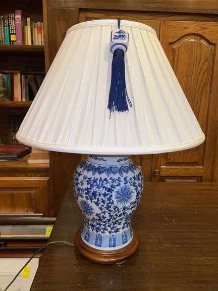 Beautiful Asian-themed blue and white ceramic body lamp with wood base and very nice pleated flare shade…..24” tall image