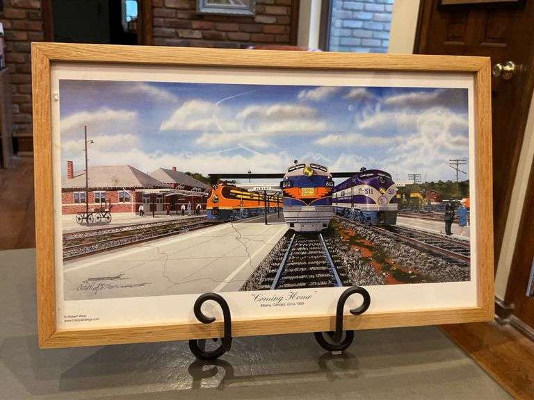 Framed Robert West limited artist proof (11/200) of a painting titled "Coming Home", depicting several trains at the Albany, Georgia, station circa 1959…..21-3/8 x 13 image
