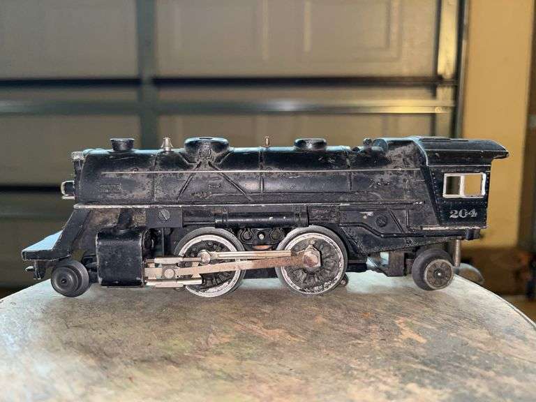 Lionel Prewar 204 diecast steam locomotive engine.  It is an O-27 gauge, 2-4-2 type model train. image