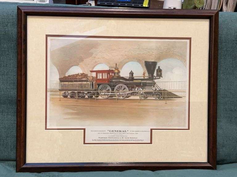 Framed print of the locomotive known as "The General," famous for its role in the American Civil War. The text below the image identifies it as the "FAMOUS WAR ENGINE 'GENERAL’”……27-3/4 x 22-3/4 image