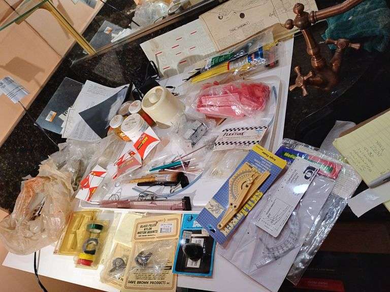 Everything from the drawers of the model work table. image