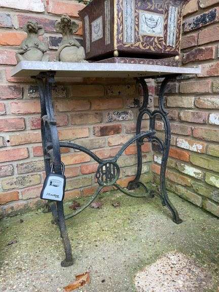 Vintage decorative wrought iron base table with marble top…..31-1/4 x 17-1/2 x 30-1/2 tall…..other contents not included (MasterLock not included) image