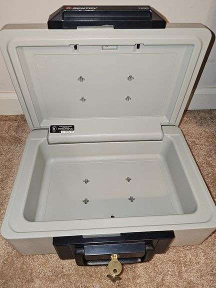 Sentry 1100 safe with key. Exterior dimensions 14 X 10.5 x 6.5 in tall.