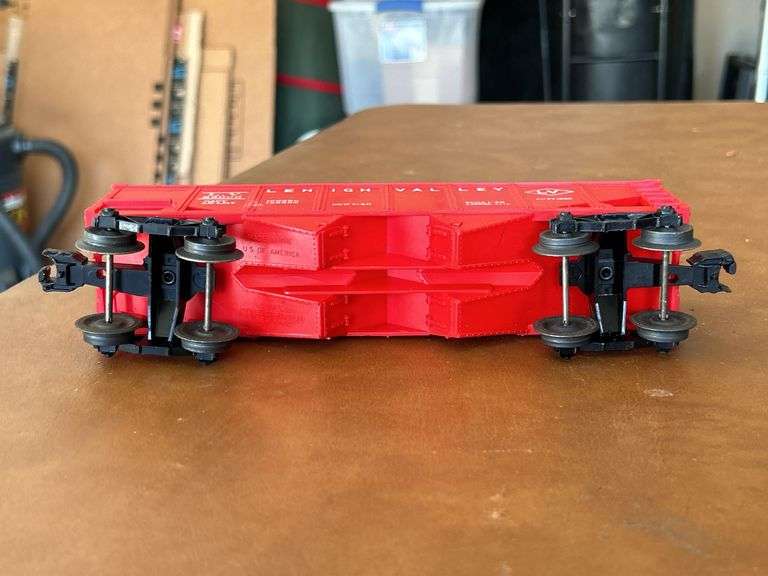 Selection of (2) Lionel Train pieces…..242 Steam Engine (with damage) and Lehigh Valley (L.V. 25000) red rail car