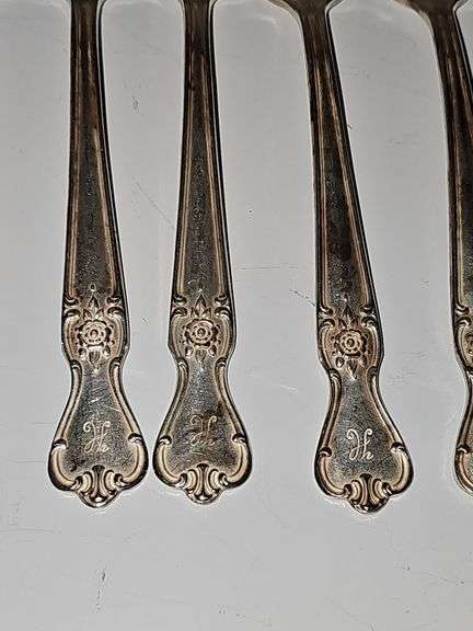Old company plate flatware possibly Signature Rose pattern. 12 dinner forks, 10 dinner knives six soup spoons 9 teaspoons monogrammed H. Circa 1940s