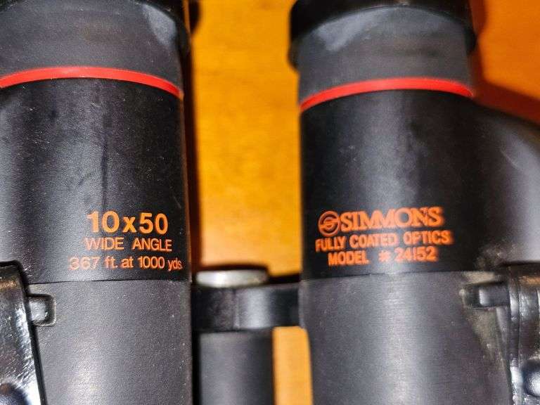 Simmons binoculars with lens caps and bag.