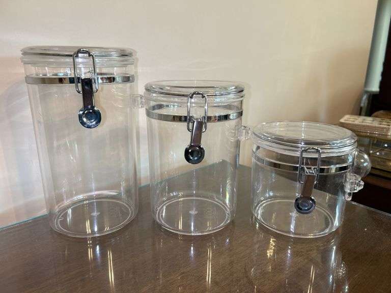 Set of (4) OGGI acrylic canisters…..only 1 has spoon….heights range from 4” to 9” tall…..another was found after initial listing