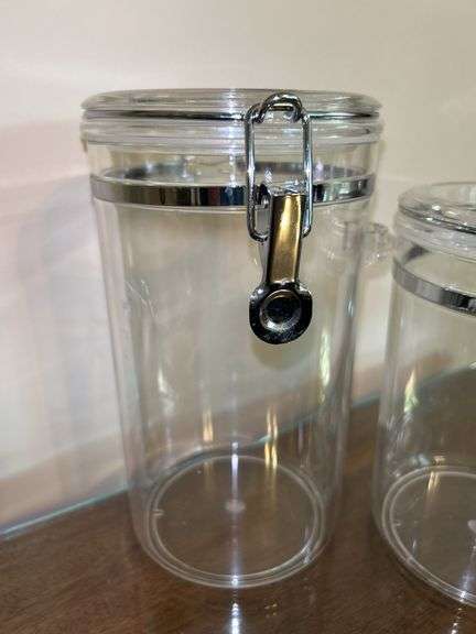 Set of (4) OGGI acrylic canisters…..only 1 has spoon….heights range from 4” to 9” tall…..another was found after initial listing