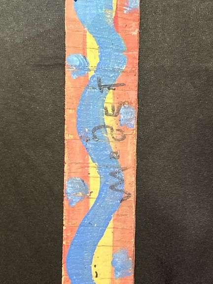 Original signed Mose T long skinny blue snake Folk Art with signature soda can tab hanger…..1-1/2 x 18