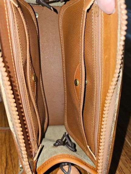 Dooney & Bourke handbag with shoulder strap.