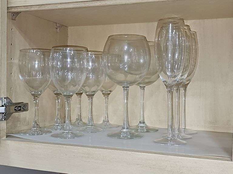 Cabinet of stemware. Matching set of 11 iced beverages, 11 wine glasses, 12 coupe champagne glasses. Matching set of 8 "H" monogrammed glasses, four shrimp cocktail stems with liners and more. See all photos.